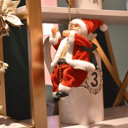 Papá Noel trepando 